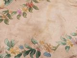 a picture of a rug with flowers and leaves on it