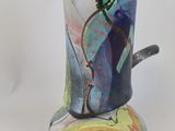 a vase that has a picture of a person on it