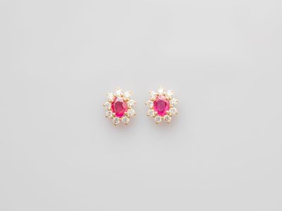 a pair of pink sapphire and diamond stud earrings
