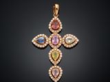 un pendentif en forme de croix en or, orné de pierres multicolores et de diamants
