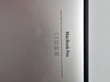 a close up of the back of a laptop with a metal cover