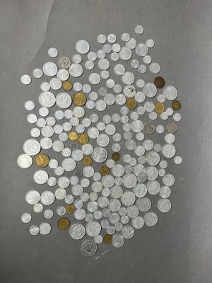 a lot of coins that are on the table