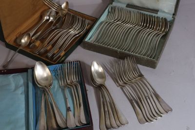 a lot of spoons and forks in a box