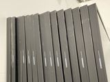 a lot of books that are stacked on top of each other