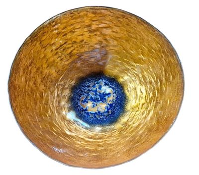 a glass bowl with a blue and yellow design on it