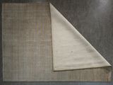 two pieces of cloth folded on top of each other on a table