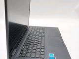 a laptop computer sitting on top of a white table