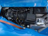 a close up of a blue car with its hood open