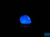 a blue light in the dark with a black background