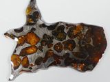 an image of a piece of metal with a cow head on it