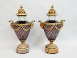 pair of antique vases with gold and purple decoration on stands