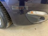 a close up of a car ' s bumper with a sticker on it