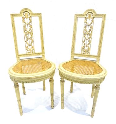 pair of antique cane back chairs with wicker seats
