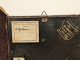 an old suitcase sitting on top of a wooden table