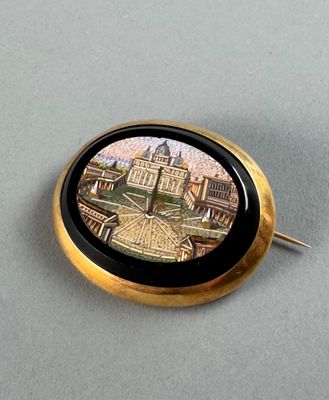a picture of a pin with a picture of a city