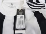a close up of a soccer jersey with a tag on it