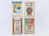 Quatre types différents de cigarettes Bayonnee sont présentés sur un support blanc