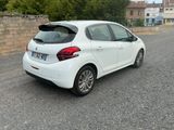 a white car that is parked on the side of the road