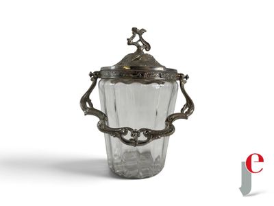 a glass vase with a bird on top of it