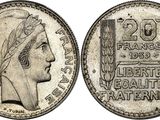 a silver coin with a woman ' s head on it