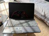 a laptop that is sitting on a table with a camera