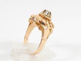a close up of a gold ring with a diamond on it