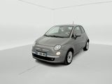 the small car is parked in a white room with a white floor