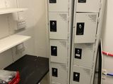 several metal lockers are stacked on top of each other in a room