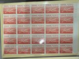 framed picture of a picture of a red and white stamp with a picture of a bird