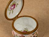 a small box that has a floral design on it