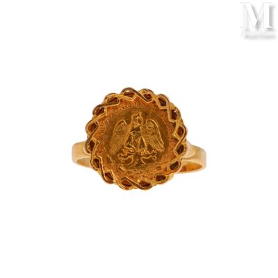 une image représentant une bague en or sur laquelle figure le portrait d'une femme