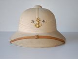 a white hat with an anchor and star on it