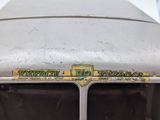 a close up of the front of a truck with a badge on it