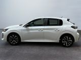 the front view of a white car parked in a parking lot