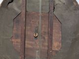 an old metal and wood clock with a bird on it