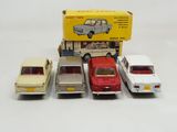 several toy cars are lined up in a row next to a box
