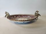an image of a bowl with two birds on it sitting on a table