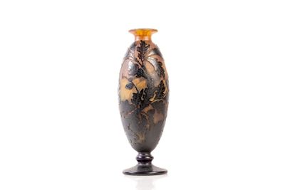 a vase that is sitting on a stand on a white surface