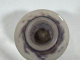 a white sink with a black and white swirl on it