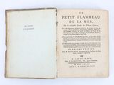 un vieux livre ouvert, dévoilant une page de texte sur fond blanc