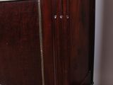 a wooden cabinet that has a clock on top of it