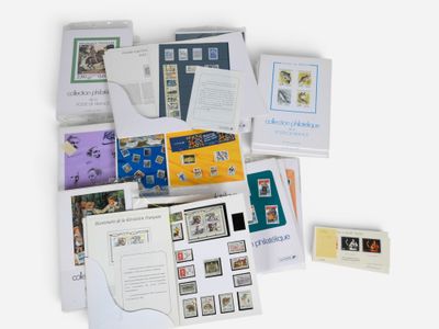 many different types of stamps and envelopes laid out on a table