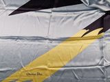 a large flag with a yellow and black design on it