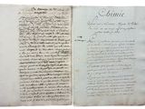 un vieux livre écrit posé sur une table