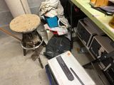 a pile of stuff on the floor next to a table