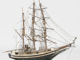 a model of a ship on a stand on a white surface