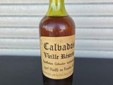 an image of a bottle of wine sitting on a table