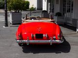 a red car that is parked in front of a building