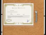 an image of a picture frame with a certificate attached to it