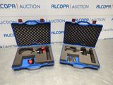 an image of two blue cases with tools in them on a table